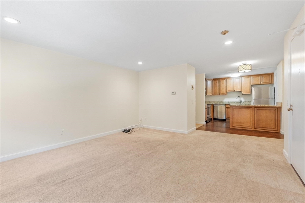 420 Great Road, Unit C1 Acton, MA 01720 - Photo 21 of 29 a view of a kitchen with a sink and a refrigerator