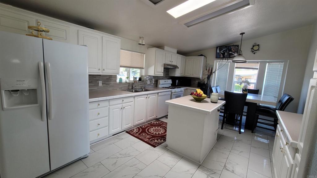 400 Greenfield Drive, Unit 1 El Cajon, CA 92021 - Photo 11 of 30 a kitchen with a sink appliances and cabinets