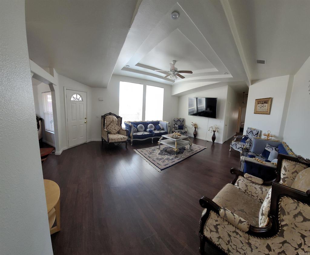 400 Greenfield Drive, Unit 1 El Cajon, CA 92021 - Photo 22 of 30 a living room with furniture and a wooden floor