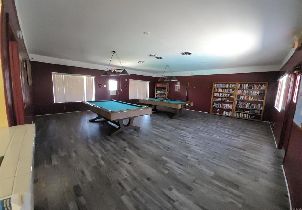 400 Greenfield Drive, Unit 1 El Cajon, CA 92021 - Photo 25 of 30 a living room with furniture and a chandelier