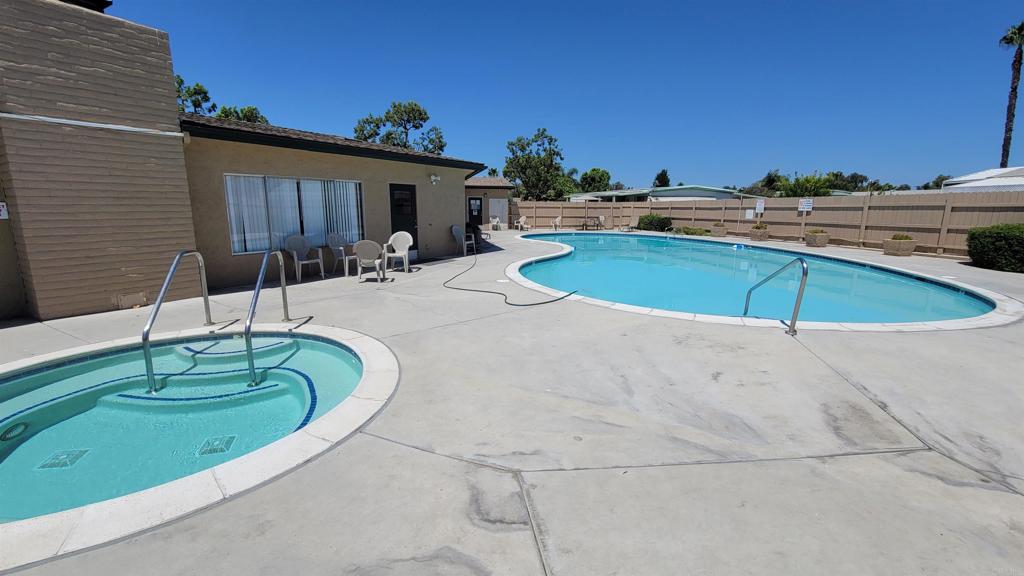 400 Greenfield Drive, Unit 1 El Cajon, CA 92021 - Photo 27 of 30 a swimming pool with outdoor seating and yard