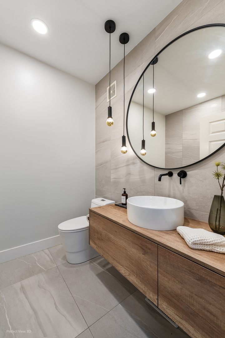 10200 Mulberry Lane, Unit G Bridgeview, IL 60455 - Photo 18 of 22 a bathroom with a sink mirror and toilet