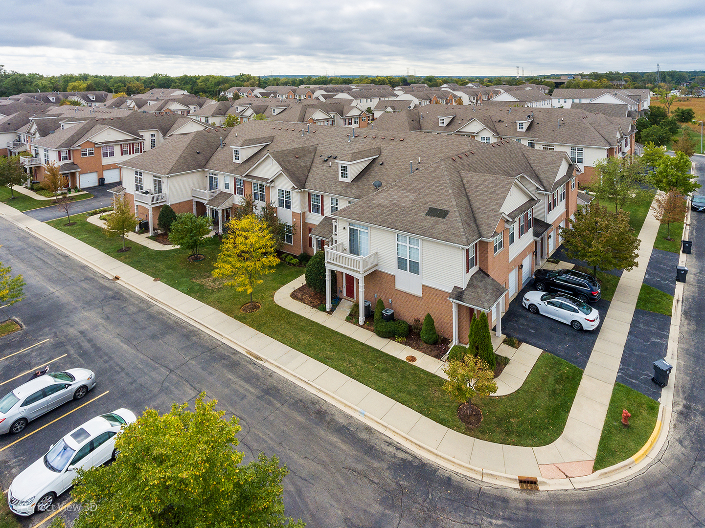 10200 Mulberry Lane, Unit G Bridgeview, IL 60455 - Photo 2 of 22 an aerial view of a house with a garden and lake view