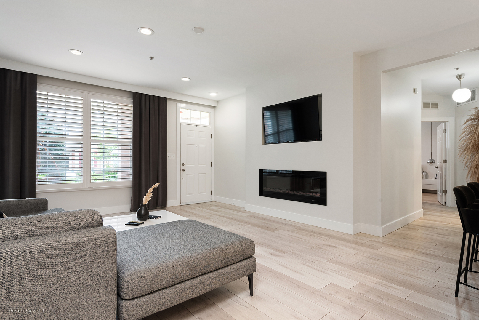 10200 Mulberry Lane, Unit G Bridgeview, IL 60455 - Photo 6 of 22 a living room with a fireplace and a flat screen tv