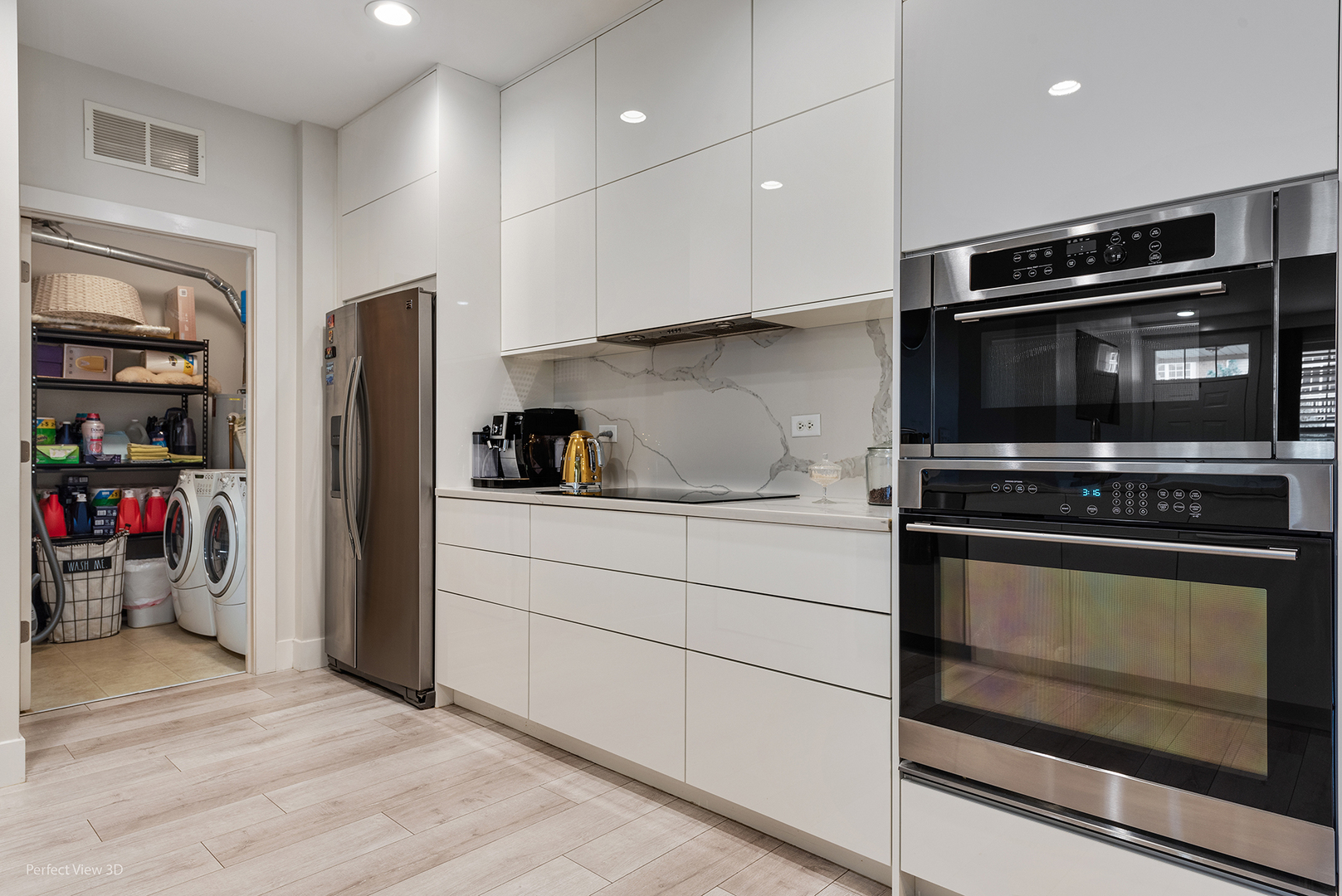 10200 Mulberry Lane, Unit G Bridgeview, IL 60455 - Photo 7 of 22 a kitchen with stainless steel appliances and view of wooden cabinets