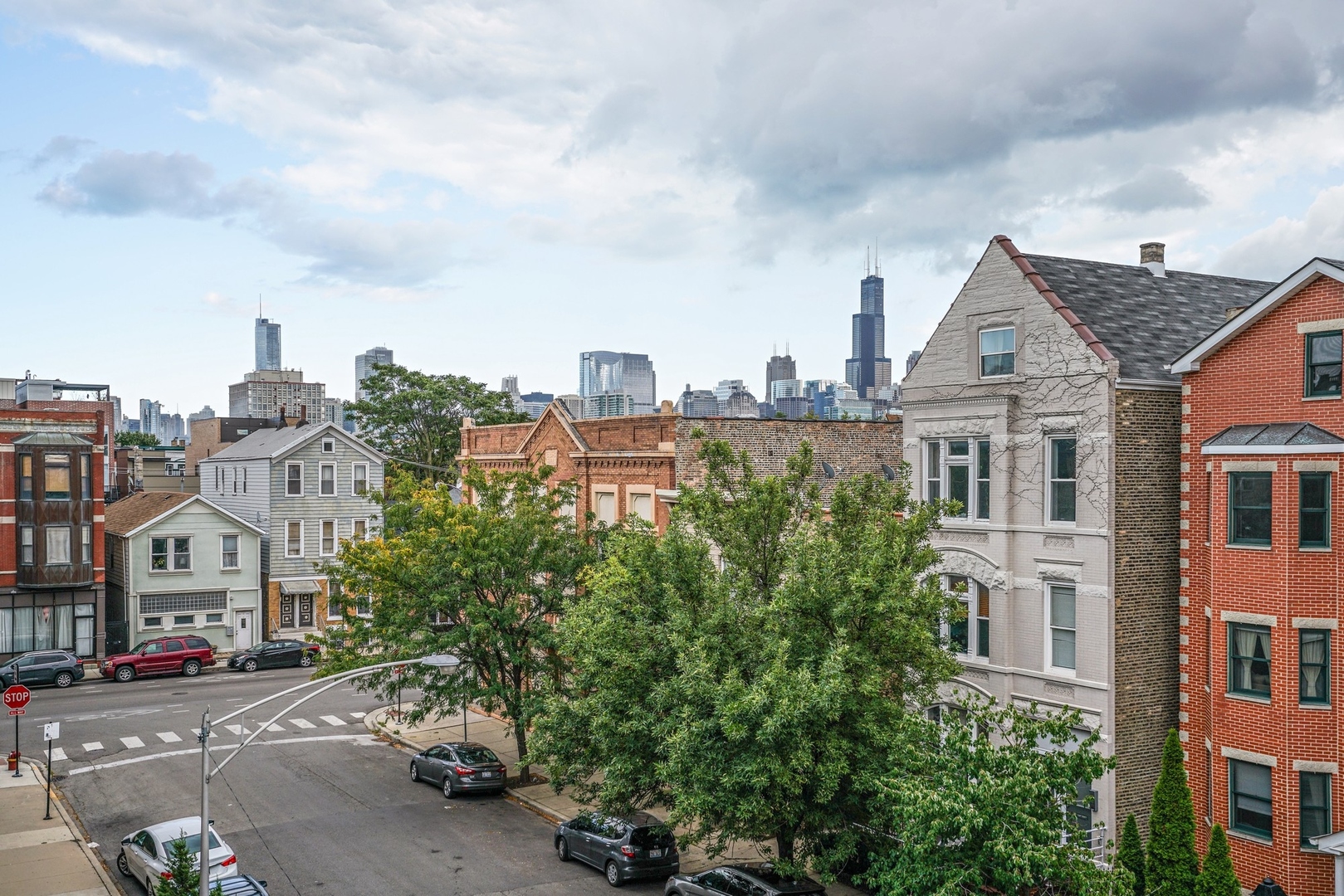 1416 West Superior Street, Unit 3F Chicago, IL 60642 - Photo 11 of 11 a view of multiple houses with a street
