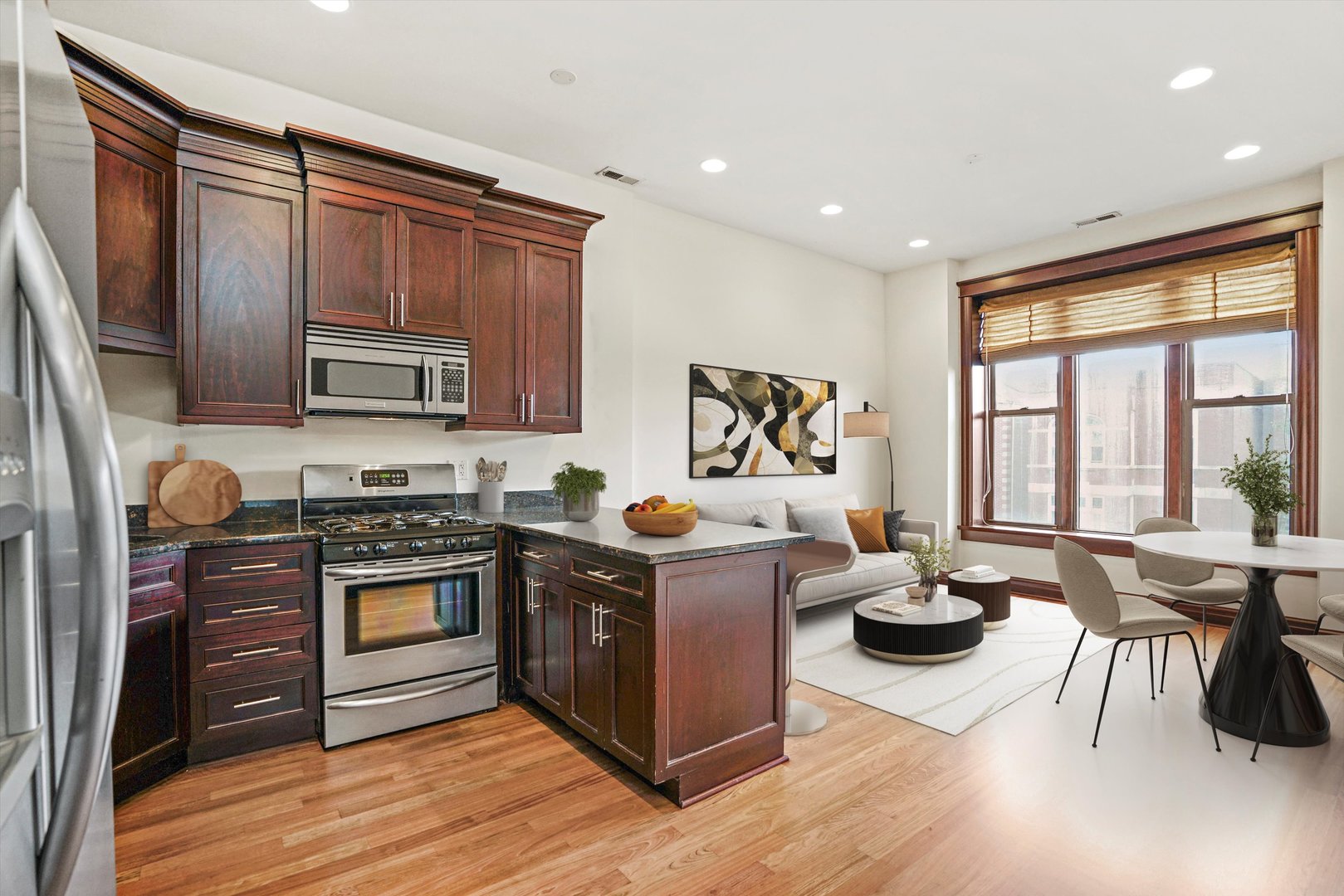 1416 West Superior Street, Unit 3F Chicago, IL 60642 - Photo 2 of 11 a kitchen with stainless steel appliances granite countertop a stove and a refrigerator