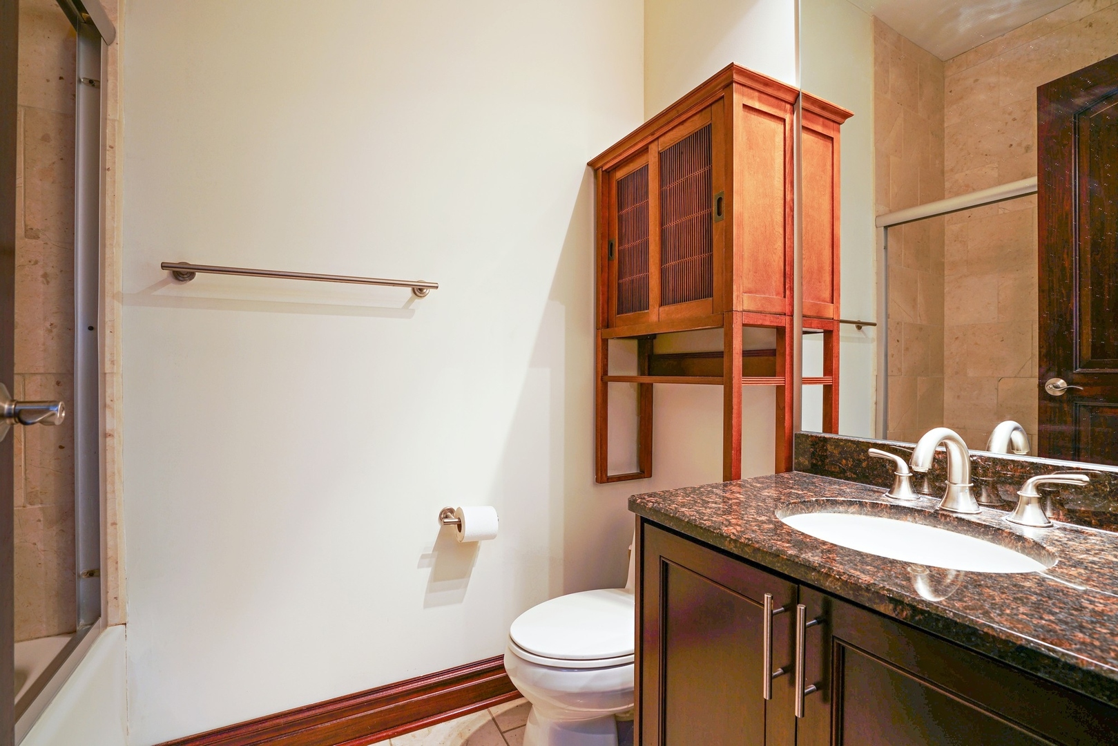 1416 West Superior Street, Unit 3F Chicago, IL 60642 - Photo 9 of 11 a bathroom with a granite countertop sink a toilet and a mirror