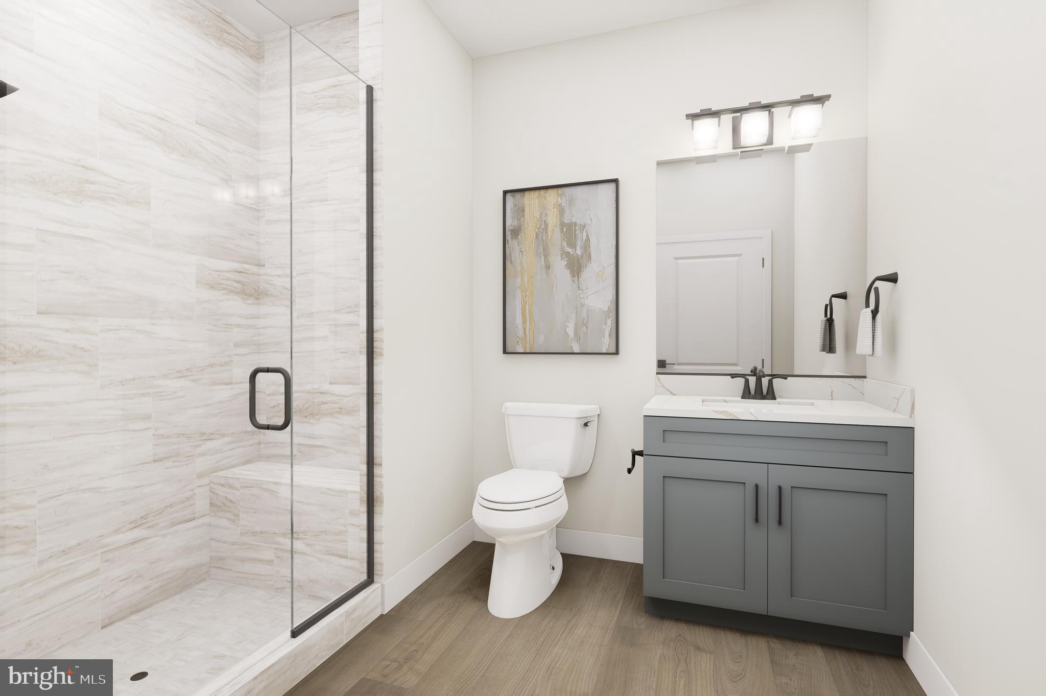 1141 Fortune Terrace, Unit 408 Potomac, MD 20854 - Photo 12 of 14 a bathroom with a toilet sink and mirror