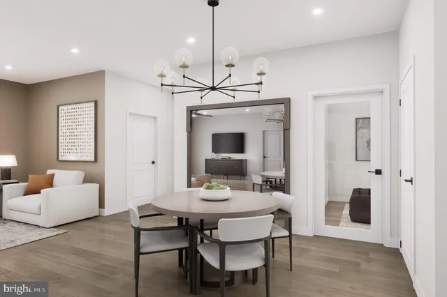 a view of a a dining room with furniture window and wooden floor