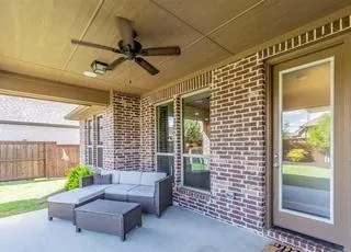 a living room with patio furniture and a window