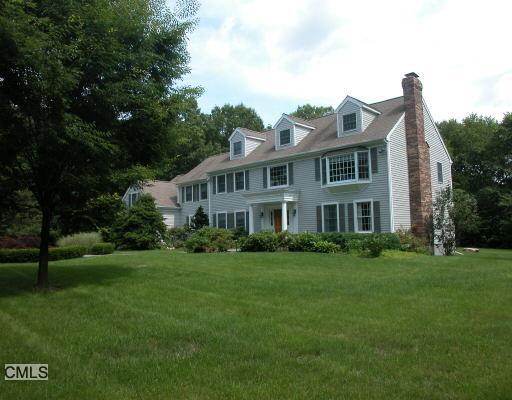 113 Vista Road Wilton, CT 06897 - Photo 1 of 1 a view of a big house with a big yard and large trees