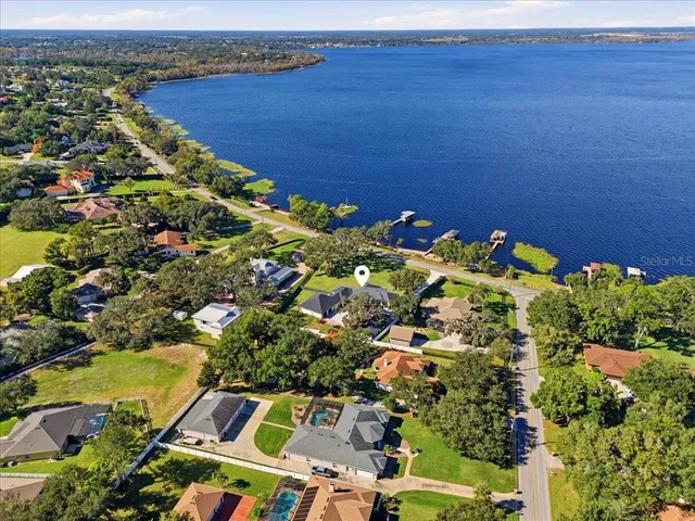 a living room with fireplace furniture and a flat screen tv