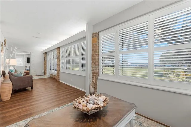 a living room with fireplace furniture and a flat screen tv