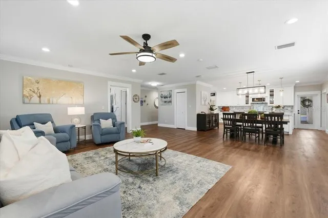 a very nice looking room with a large window and chandelier