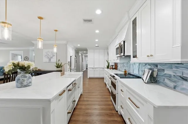 a spacious bedroom with a bed and a flat screen tv