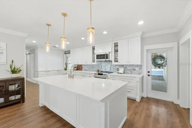 a spacious bathroom with a double vanity sink and a mirror