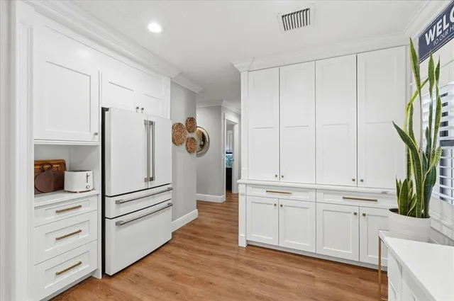 a spacious bathroom with a double vanity sink mirror and double
