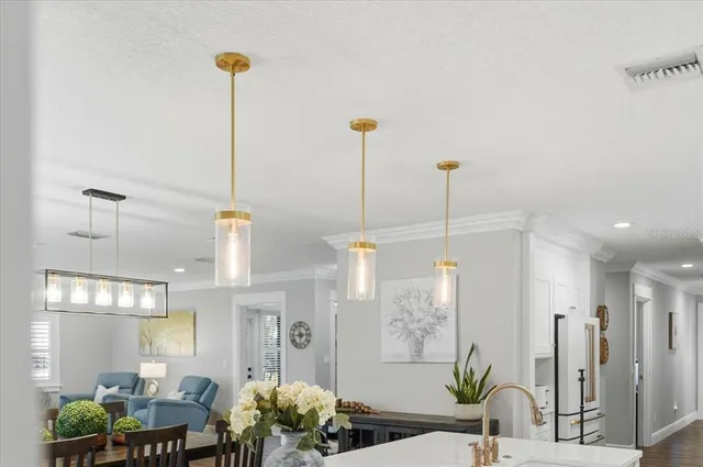 a kitchen with a wooden floor and a cabinets