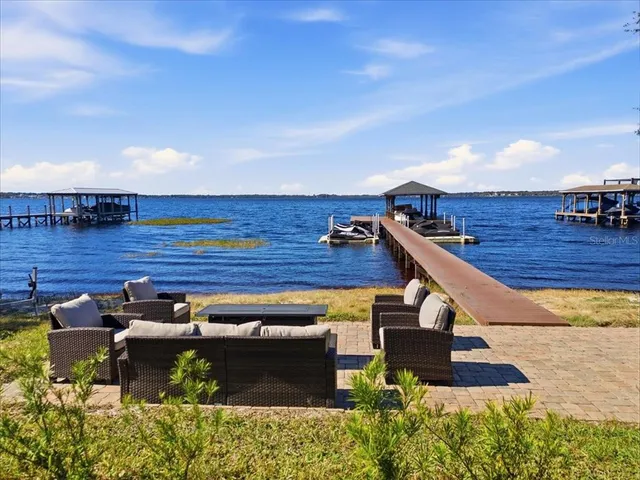 an aerial view of a tennis ground and a ocean view