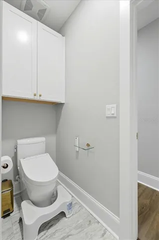 a kitchen with kitchen island a refrigerator stove microwave and cabinets