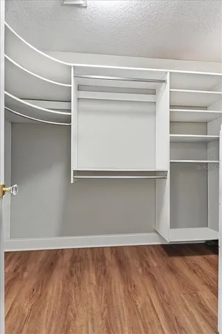 a bathroom with a sink toilet a mirror and shower