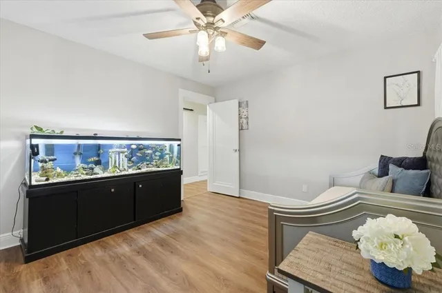 a view of a swimming pool with an outdoor seating and a garden