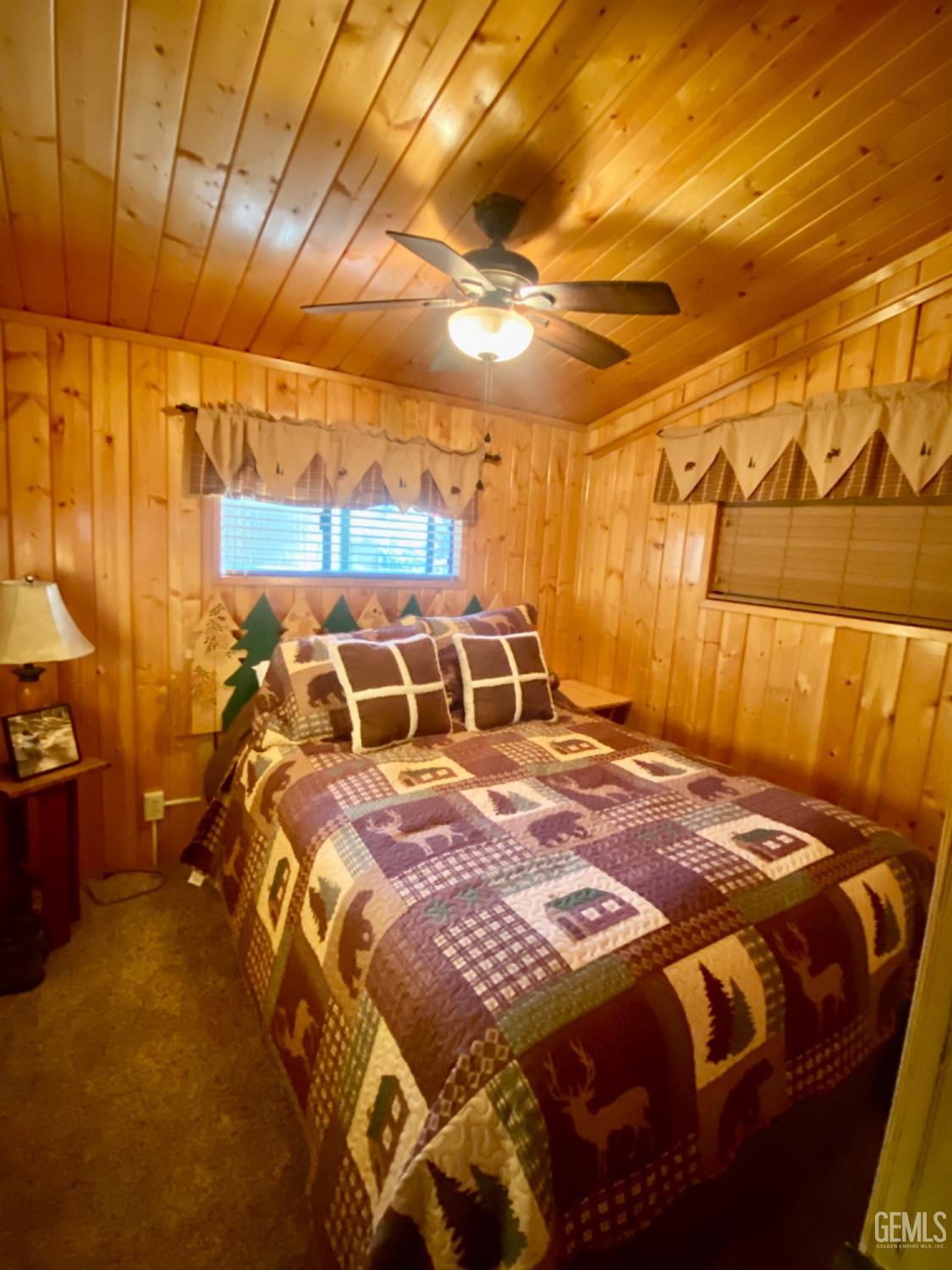 Undisclosed Address Posey, CA 93260 - Photo 11 of 26 a bedroom with a bed and a walk in closet