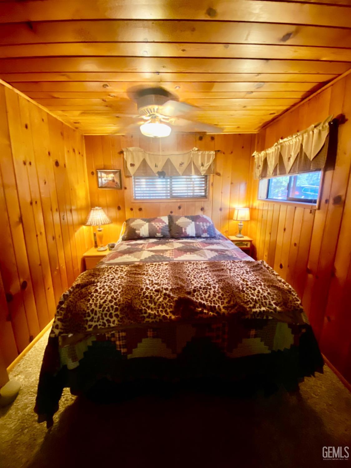 Undisclosed Address Posey, CA 93260 - Photo 12 of 26 a bedroom with a bed and a walk in closet