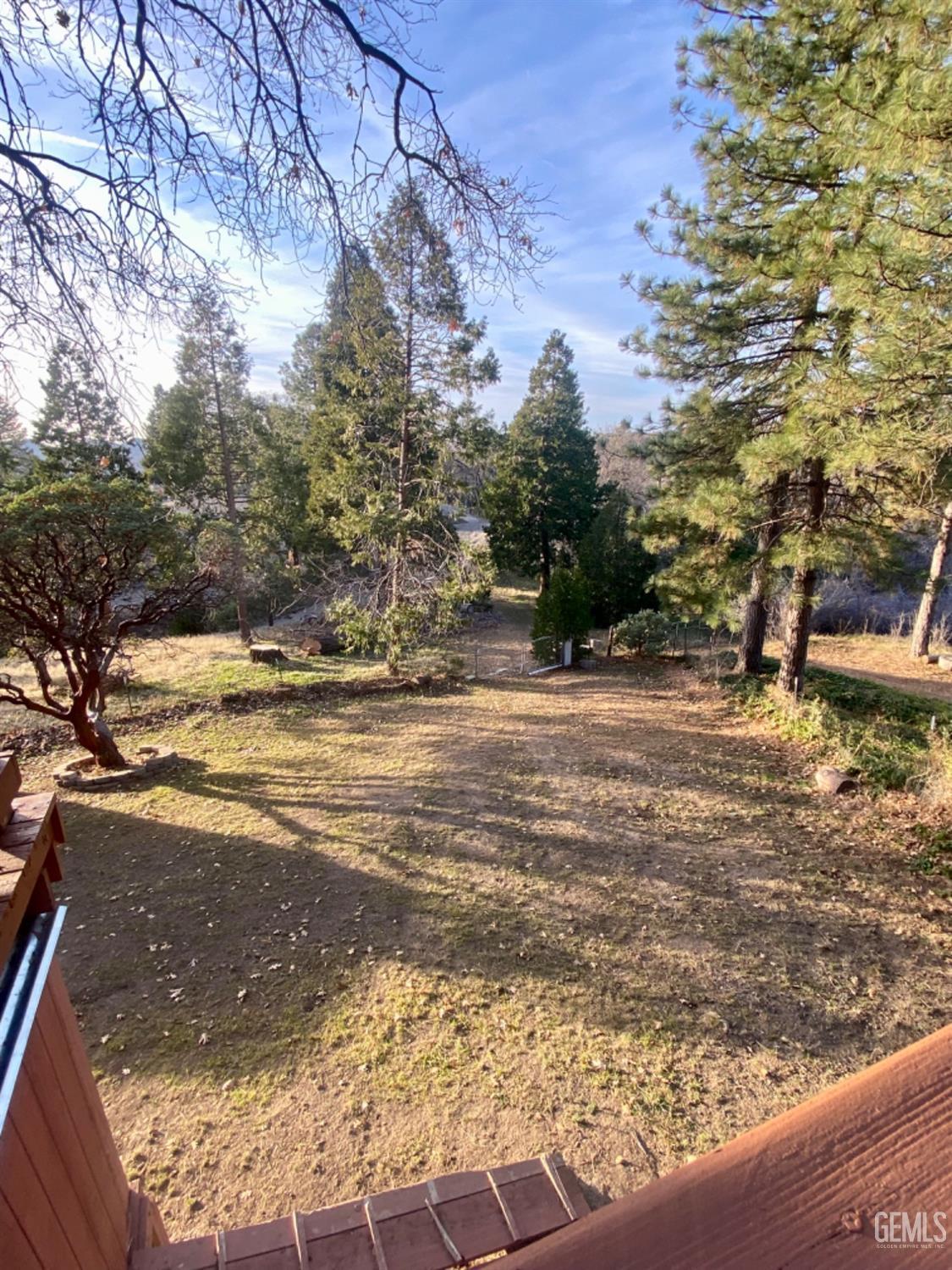Undisclosed Address Posey, CA 93260 - Photo 19 of 26 a view of a yard with an ocean view