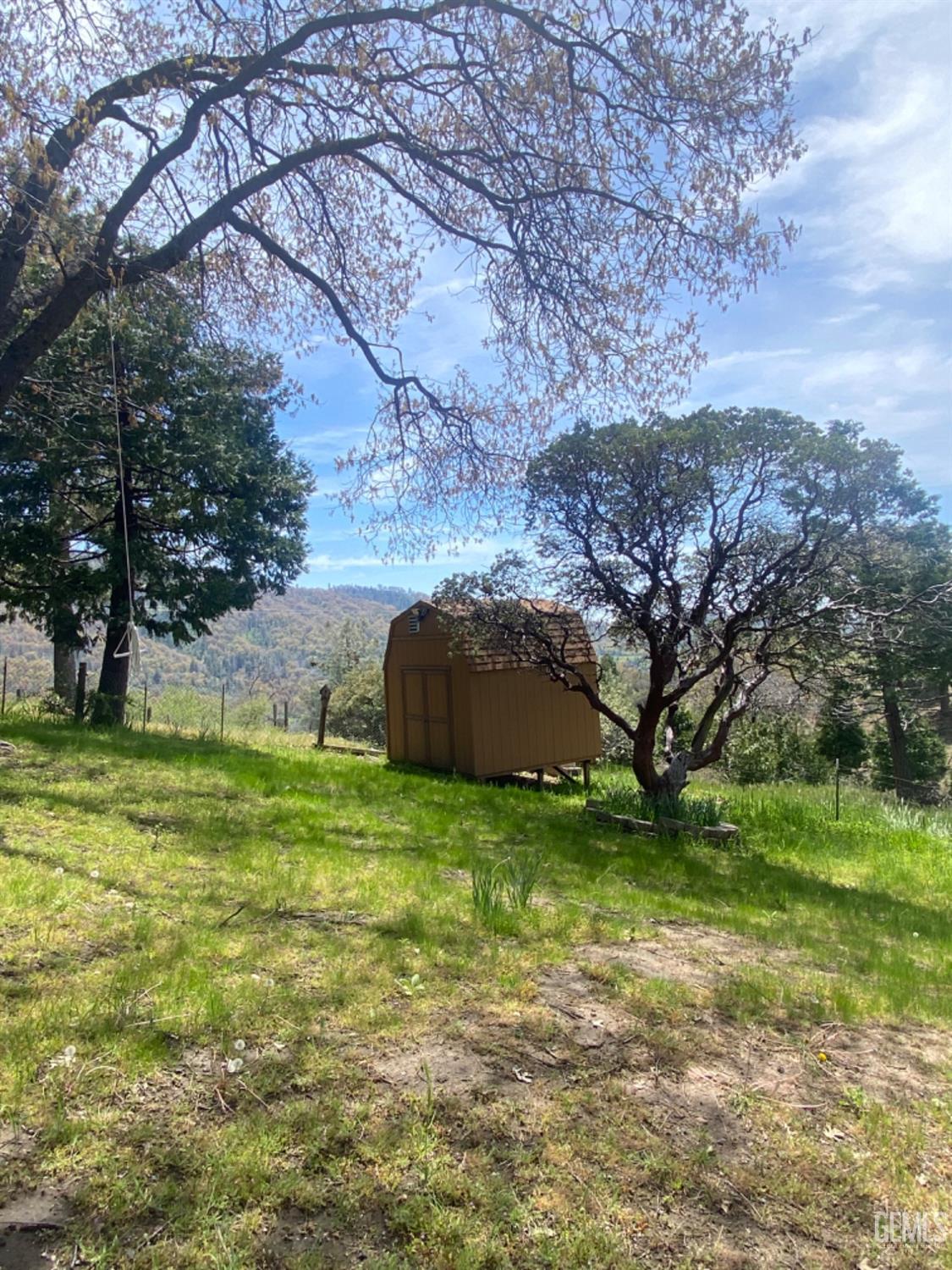 Undisclosed Address Posey, CA 93260 - Photo 25 of 26 a backyard of a house with lots of green space