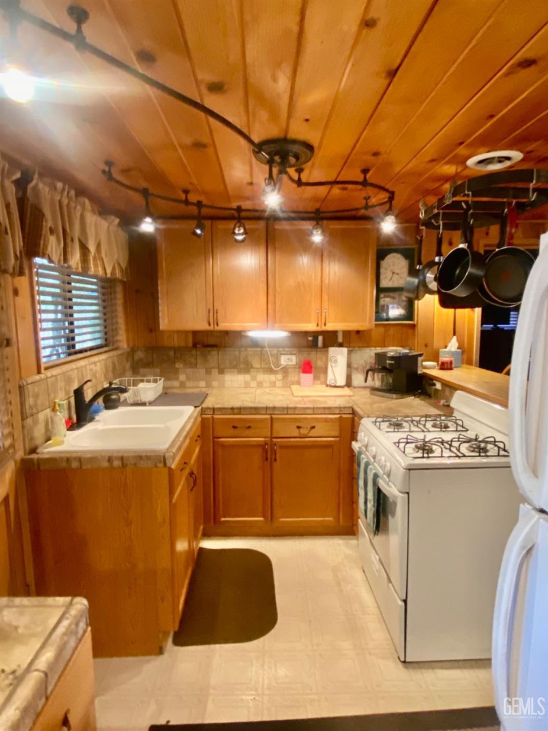 Undisclosed Address Posey, CA 93260 - Photo 3 of 26 a kitchen with a stove and a refrigerator