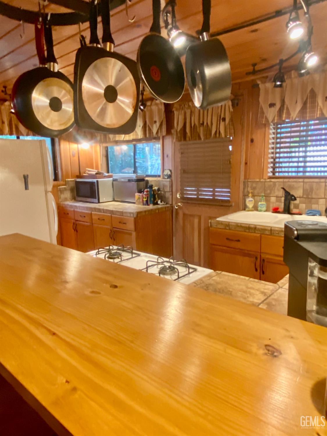 Undisclosed Address Posey, CA 93260 - Photo 5 of 26 a view of a room with a sink and chandelier