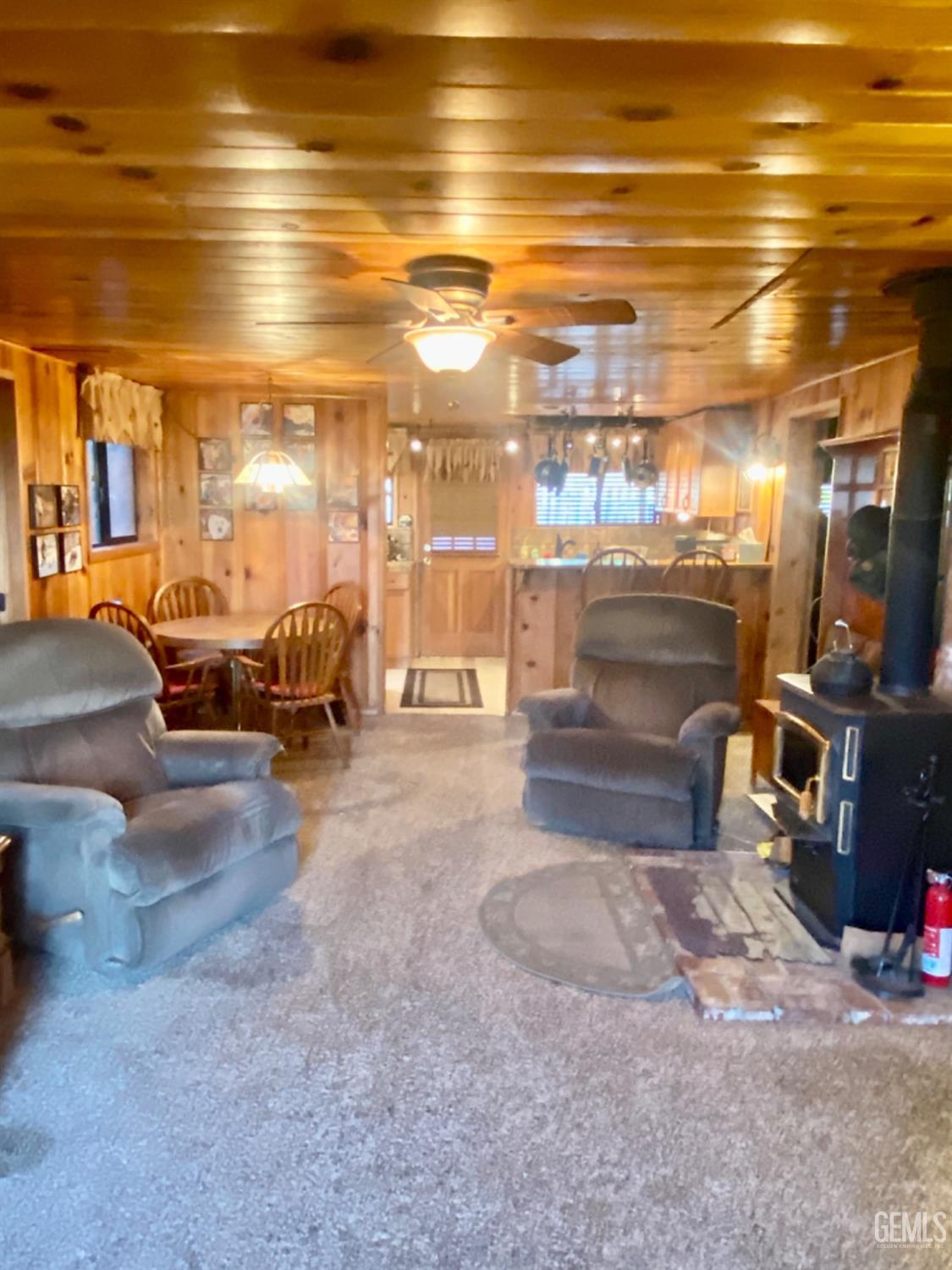 Undisclosed Address Posey, CA 93260 - Photo 8 of 26 a living room with lots of furniture and a flat screen tv