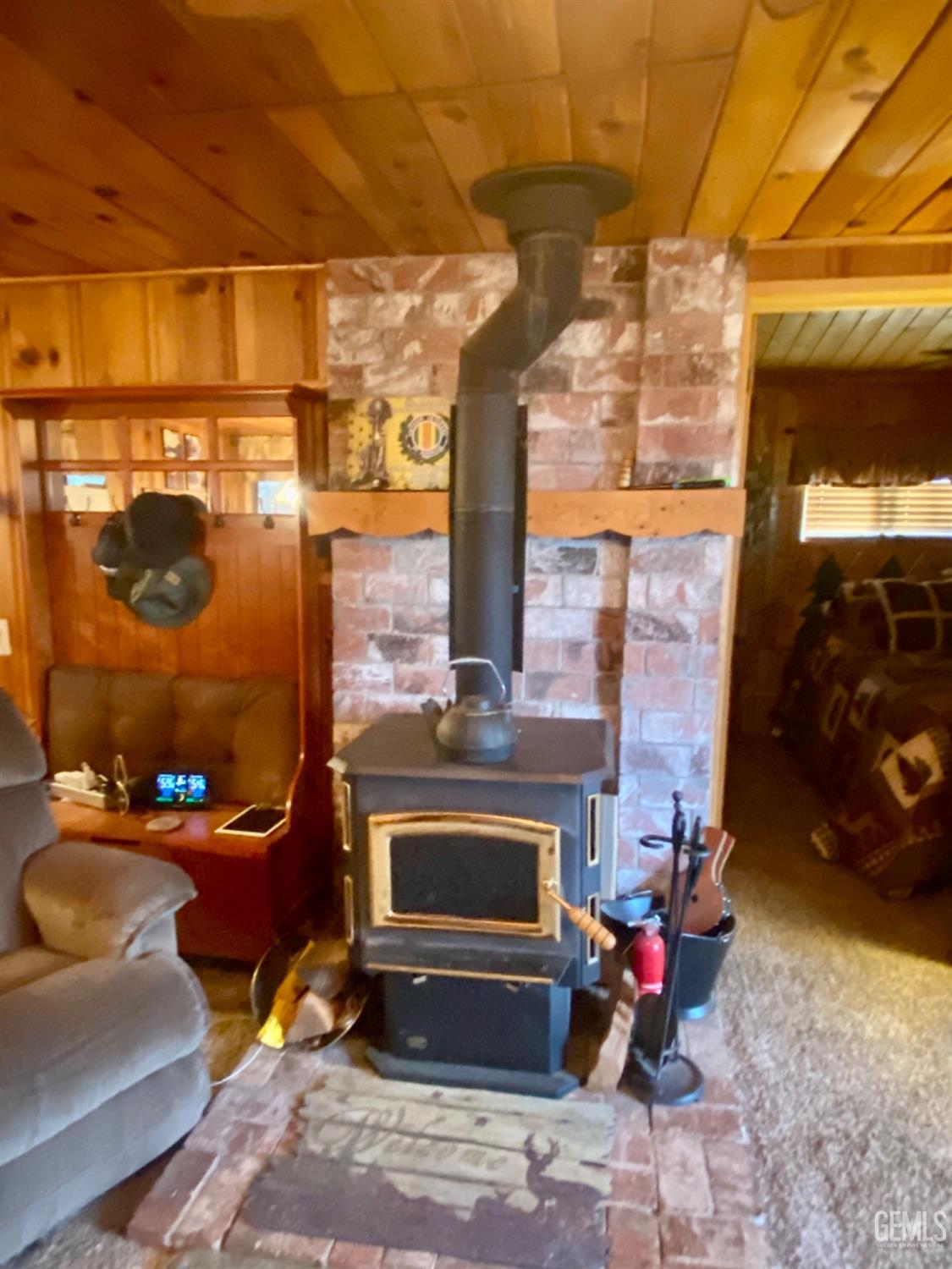 Undisclosed Address Posey, CA 93260 - Photo 9 of 26 a living room with furniture and a fireplace