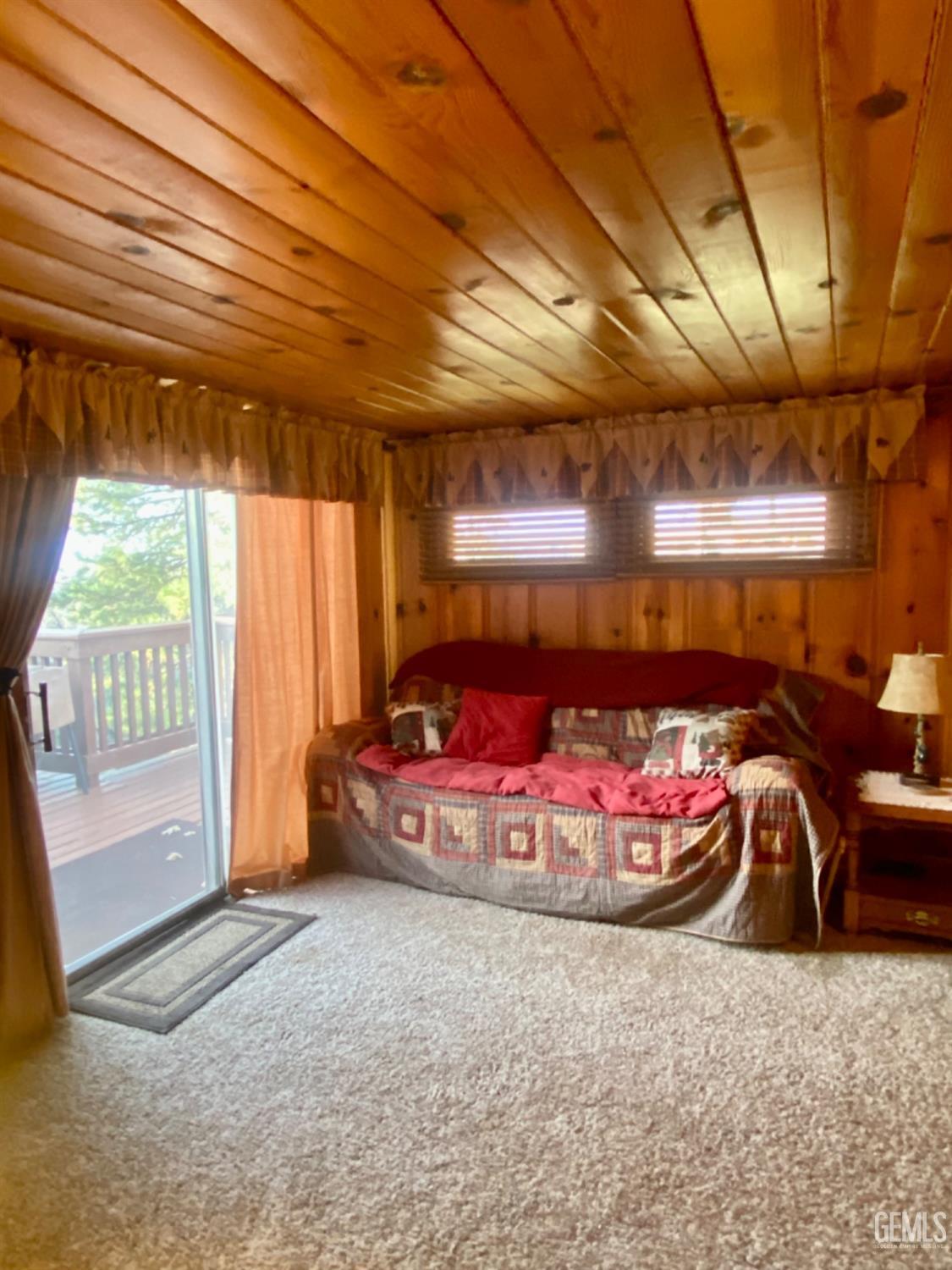 Undisclosed Address Posey, CA 93260 - Photo 10 of 26 a room with a bed and large windows