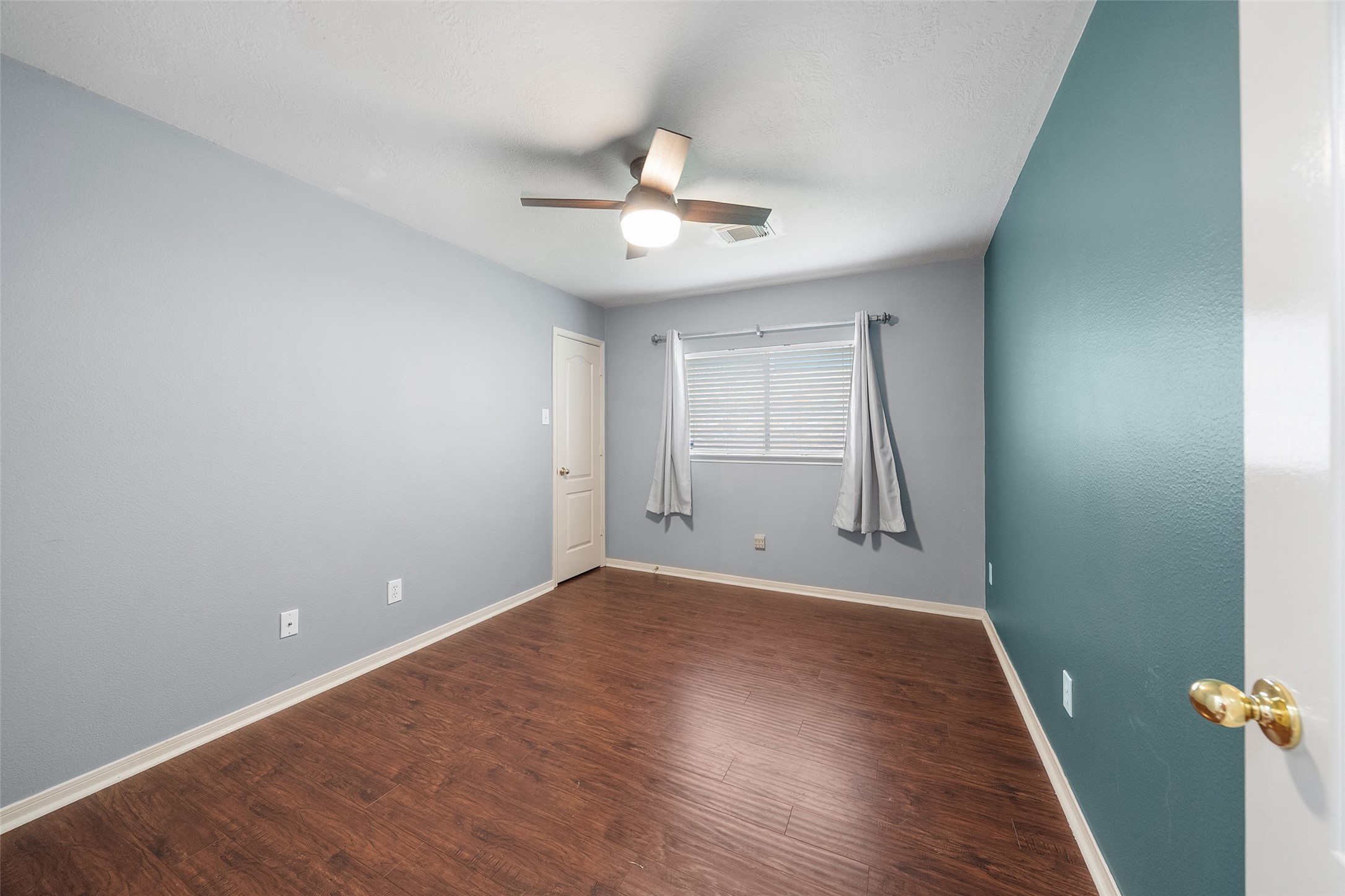 19718 Teller Boulevard Spring, TX 77388 - Photo 25 of 47 wooden floor in an empty room with a window