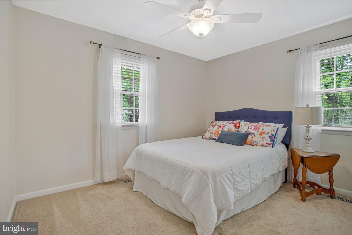 91 Scotts Cove Road Edgewater, MD 21037 - Photo 19 of 40 Serene bedroom with natural light.