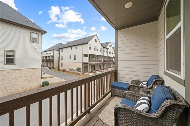 a view of balcony with furniture