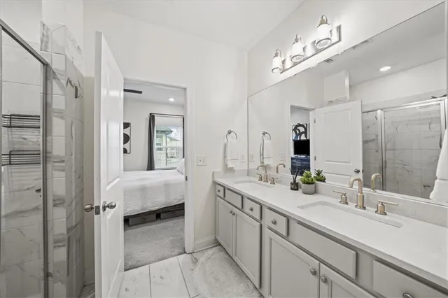 a spacious bathroom with a double vanity sink mirror and double