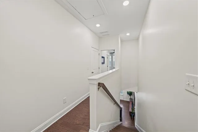a view of a hallway with stairs