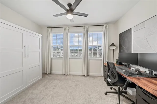 a workspace with furniture and window