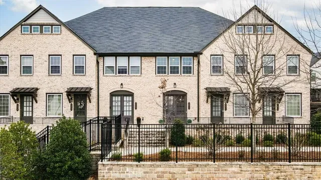 a front view of a house with glass windows