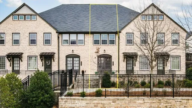 a front view of a house with glass windows
