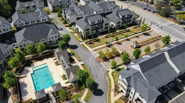 an aerial view of multiple houses with yard