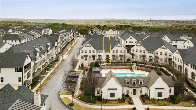 a view of buildings with ocean view