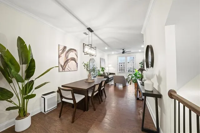 a view of a livingroom with furniture and a potted plant