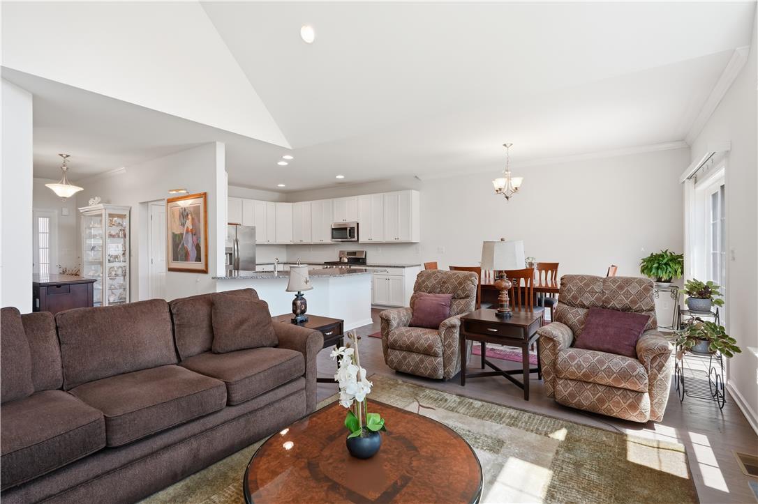4120 Eveningstar Road Emmaus, PA 18049 - Photo 22 of 62 An inviting open-concept living area seamlessly connects to the kitchen and dining space, perfect for entertaining.