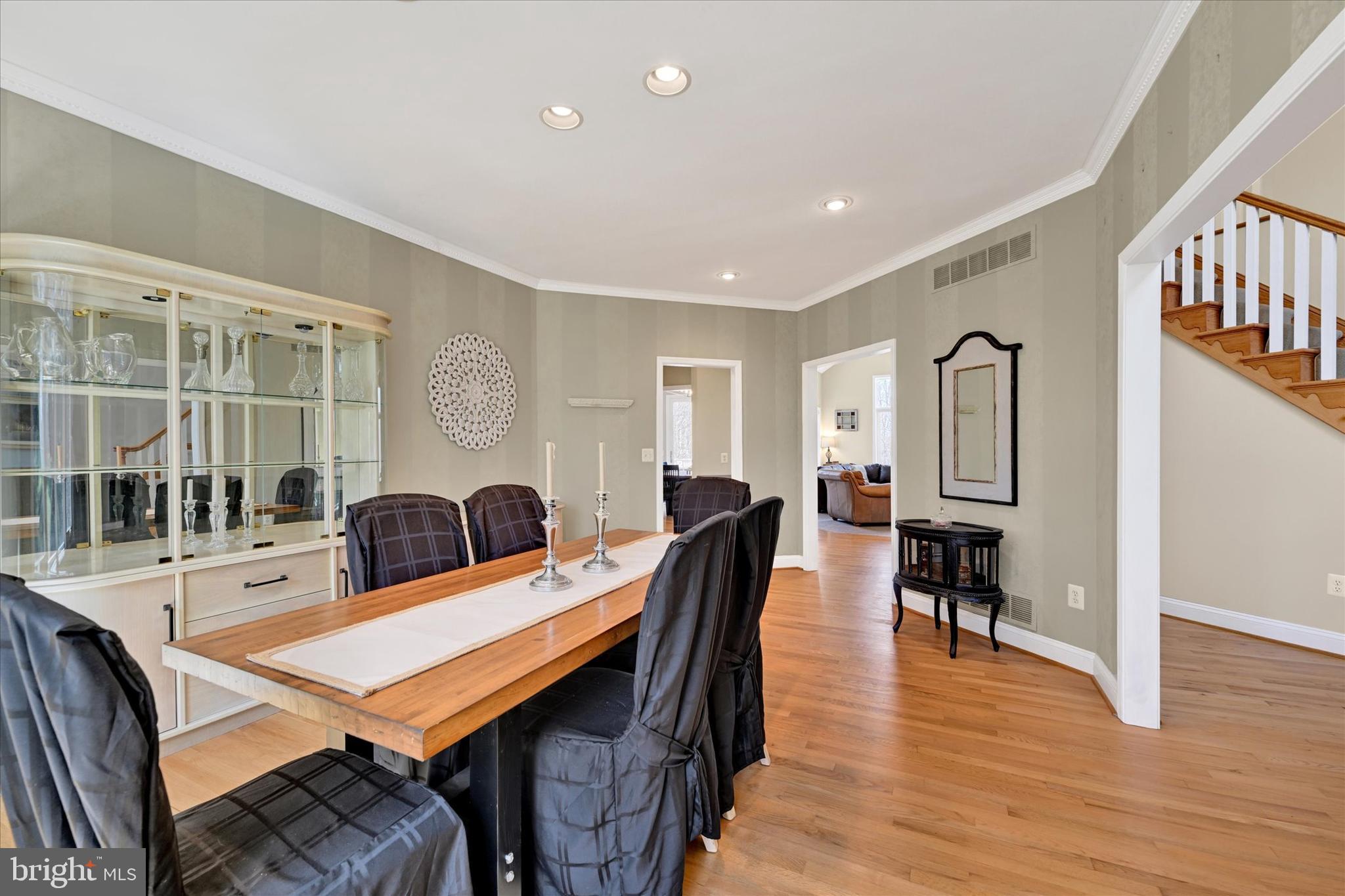 9 Liberty Ridge Court Reisterstown, MD 21136 - Photo 14 of 42 a living room with furniture a table and wooden floor