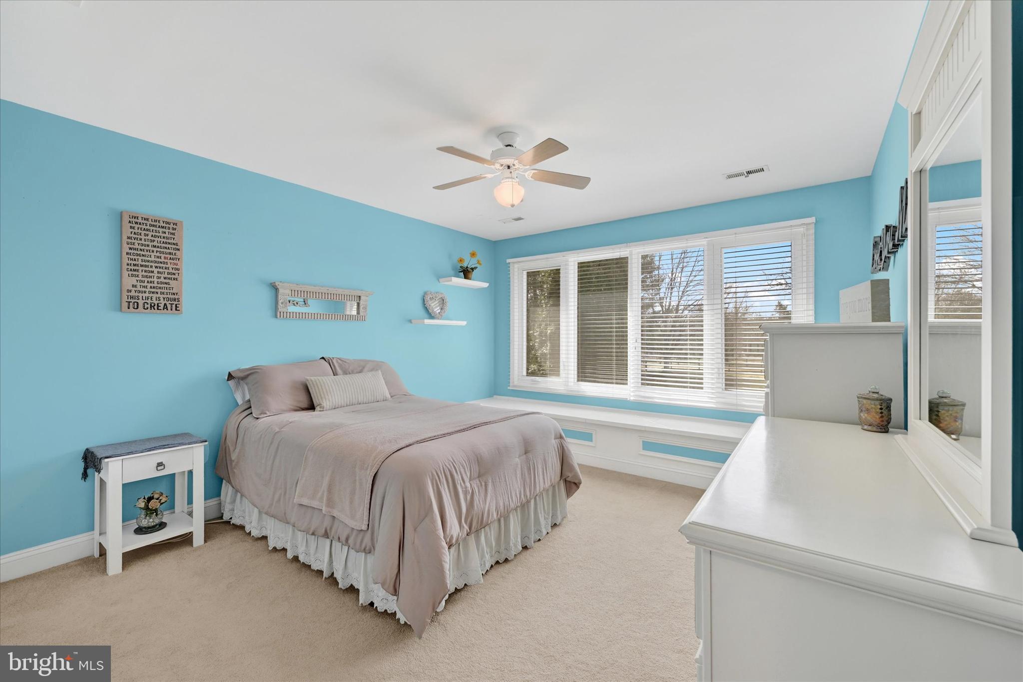 9 Liberty Ridge Court Reisterstown, MD 21136 - Photo 23 of 42 a spacious bedroom with a large bed and a chandelier